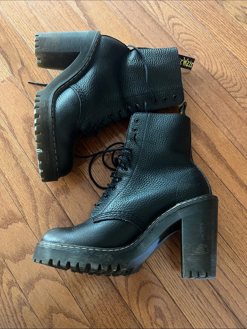 Dr. Martens Black Leather Lace-Up Platform Boots.